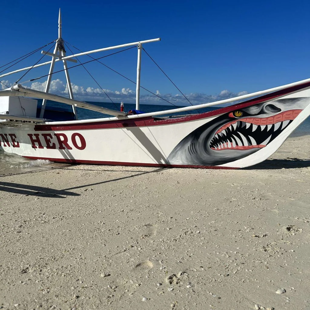 Hero House Bantayan and its famous boat named "One Hero." copy