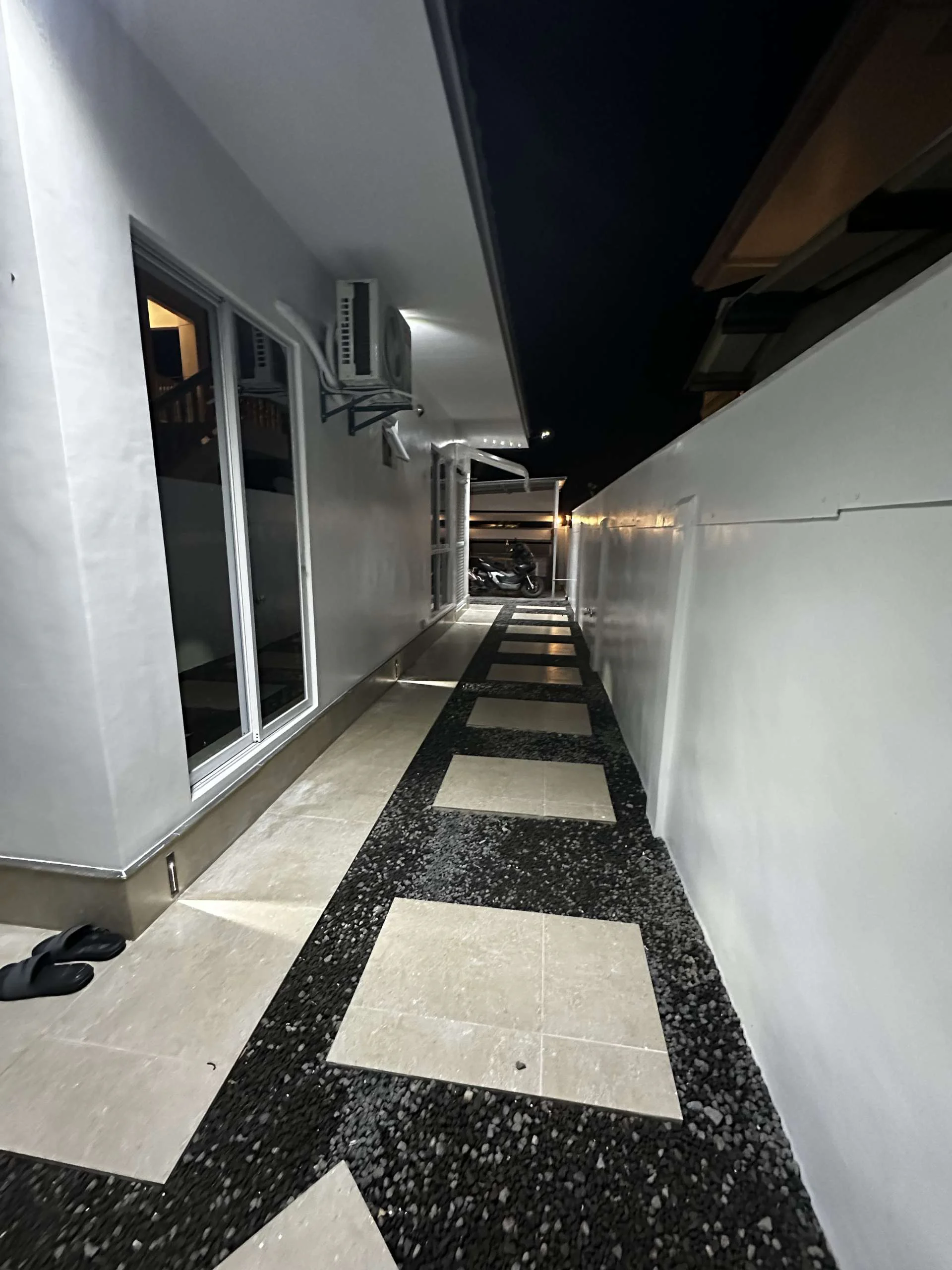 Hero House bantayan walking area in the night with light