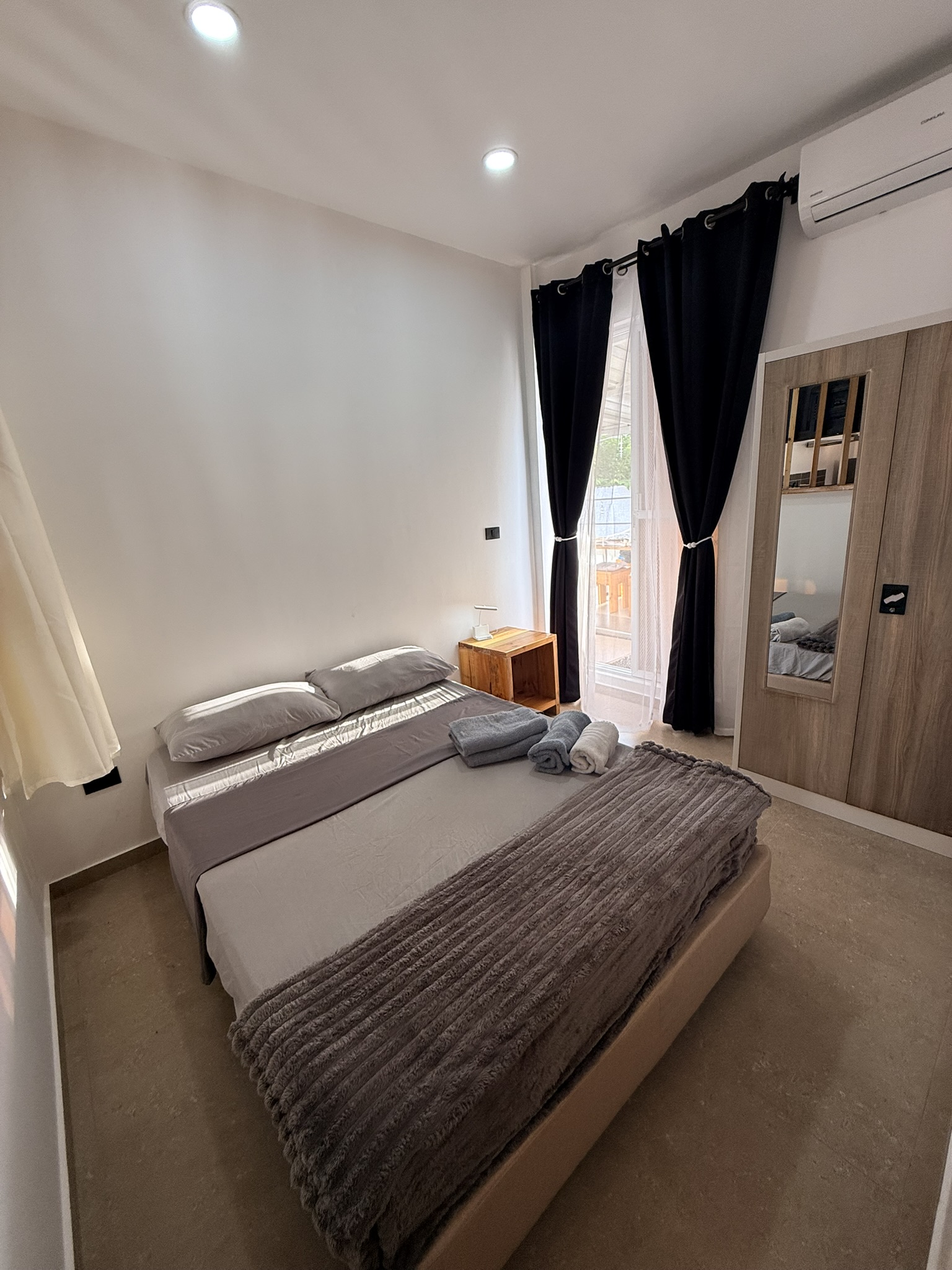 bedroom, where you will stay. It consists of a double bed, wardrobe and bedside table.
